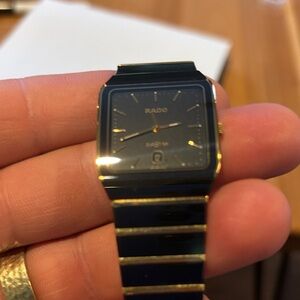 Rado Luxurious Black and Gold Timepiece